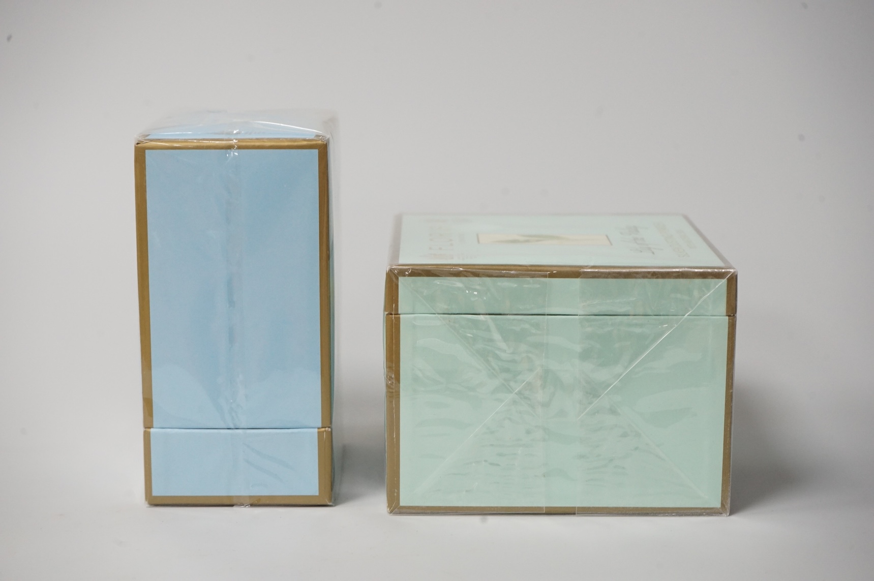 Three bottle of ladies unopened Floris perfumes comprising two bottles of Fleur and one bottle of Special No. 127, together with Floris Lily of the Valley silken dusting powder, each boxed and cellophane wrapped